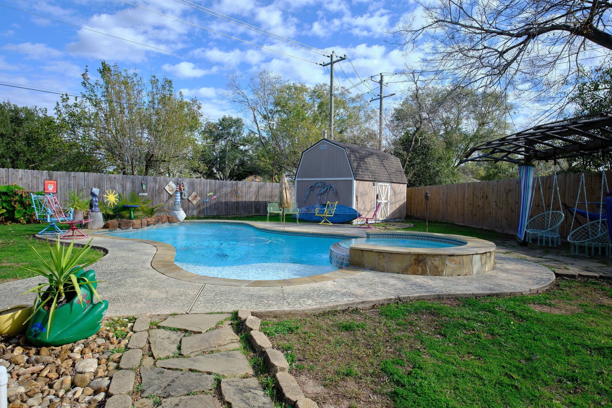 729 Newman Street Angleton, TX 77515 - Photo 21 of 24 a view of a patio with table and chairs potted plants and large tree