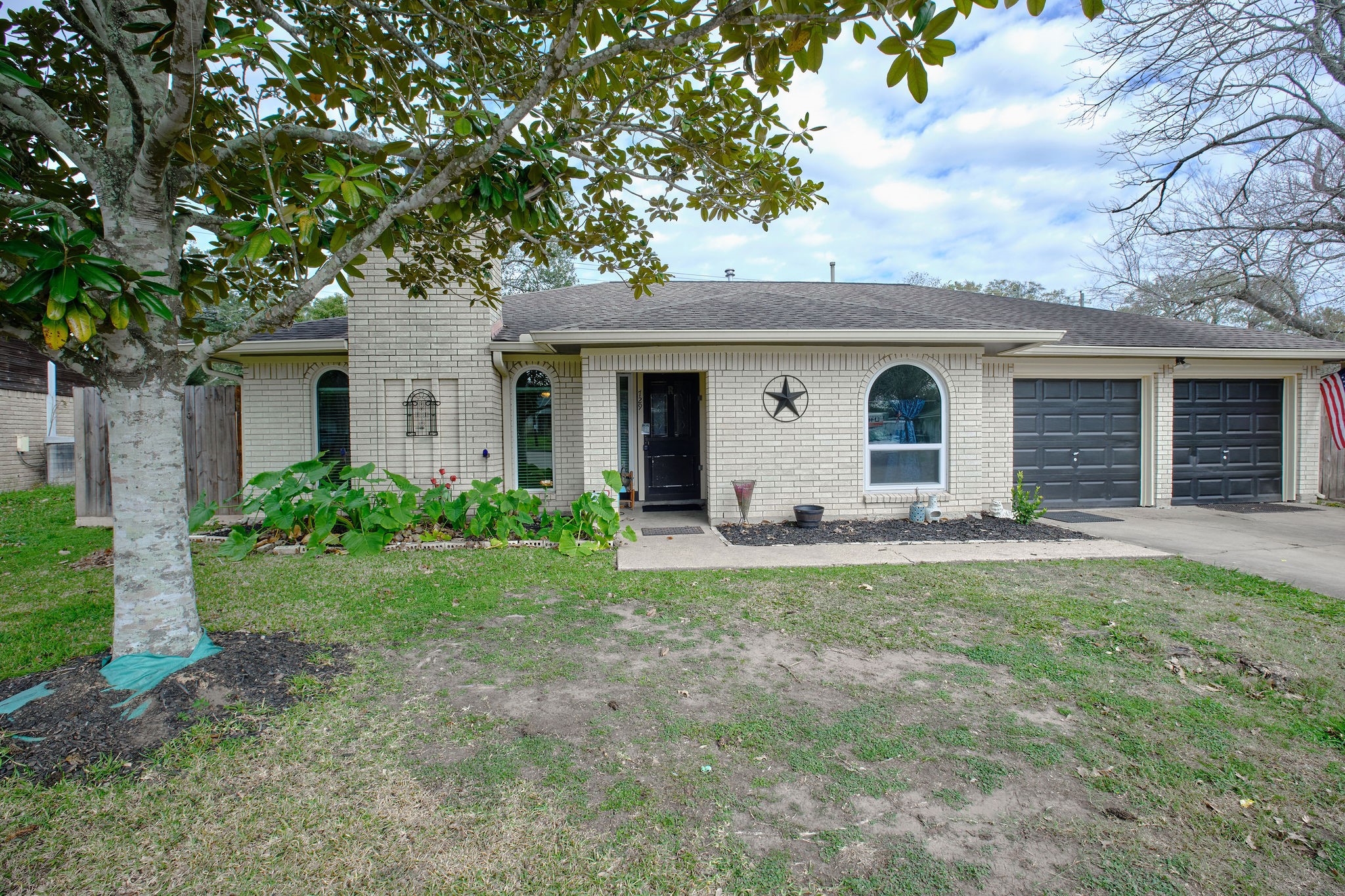 729 Newman Street Angleton, TX 77515 - Photo 23 of 24 a view of a house with a yard