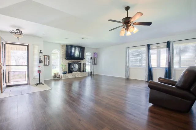 a view of livingroom with furniture wooden floor and window