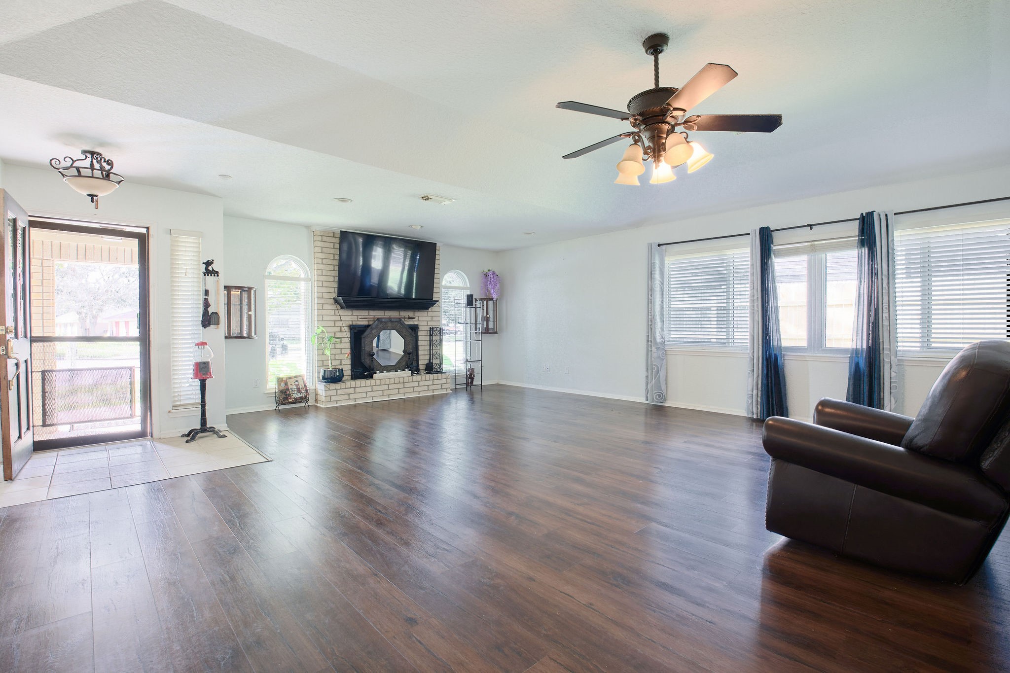 729 Newman Street Angleton, TX 77515 - Photo 3 of 24 a view of livingroom with furniture wooden floor and window
