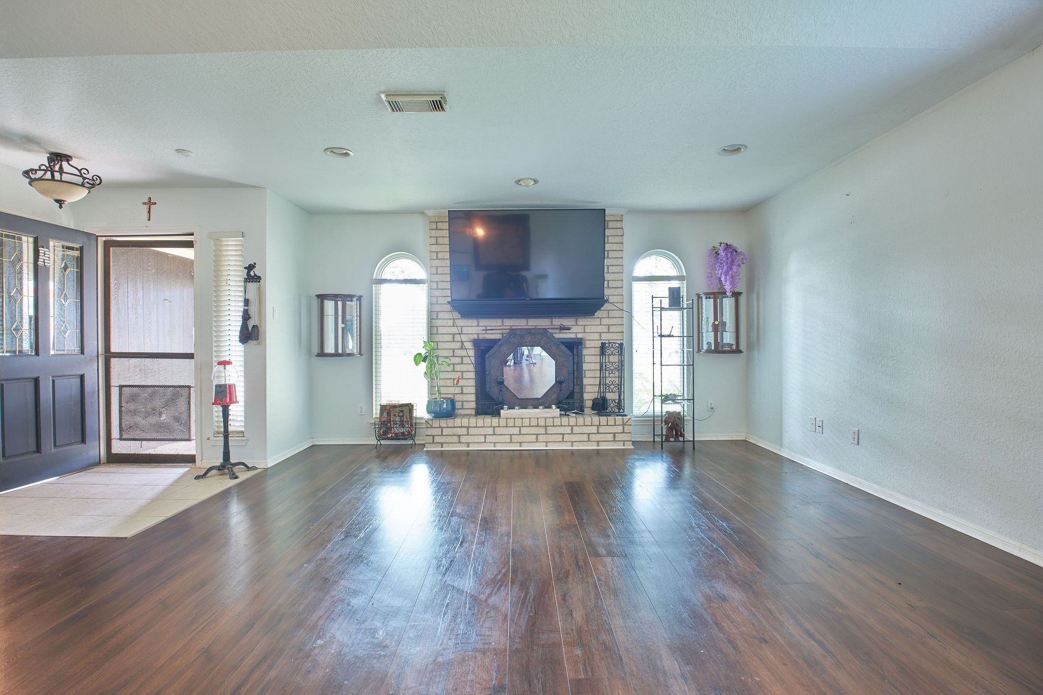 729 Newman Street Angleton, TX 77515 - Photo 4 of 24 a view of empty room with wooden floor