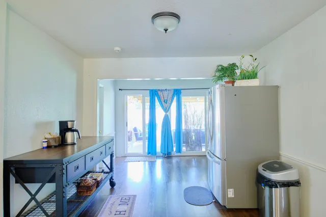 a view of an entryway with wooden floor