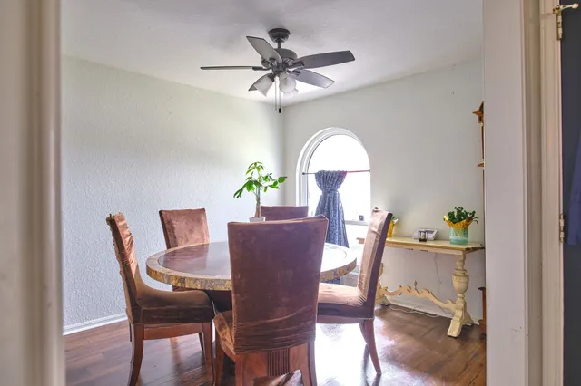 a dining room with furniture and window