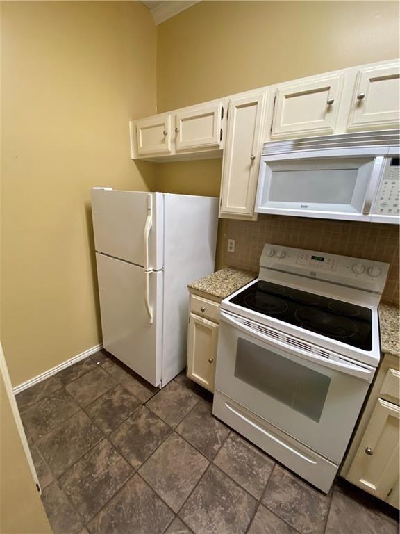 2802 Nueces Street, Unit 311 Austin, TX 78705 - Photo 2 of 13 a utility room with dryer and washer