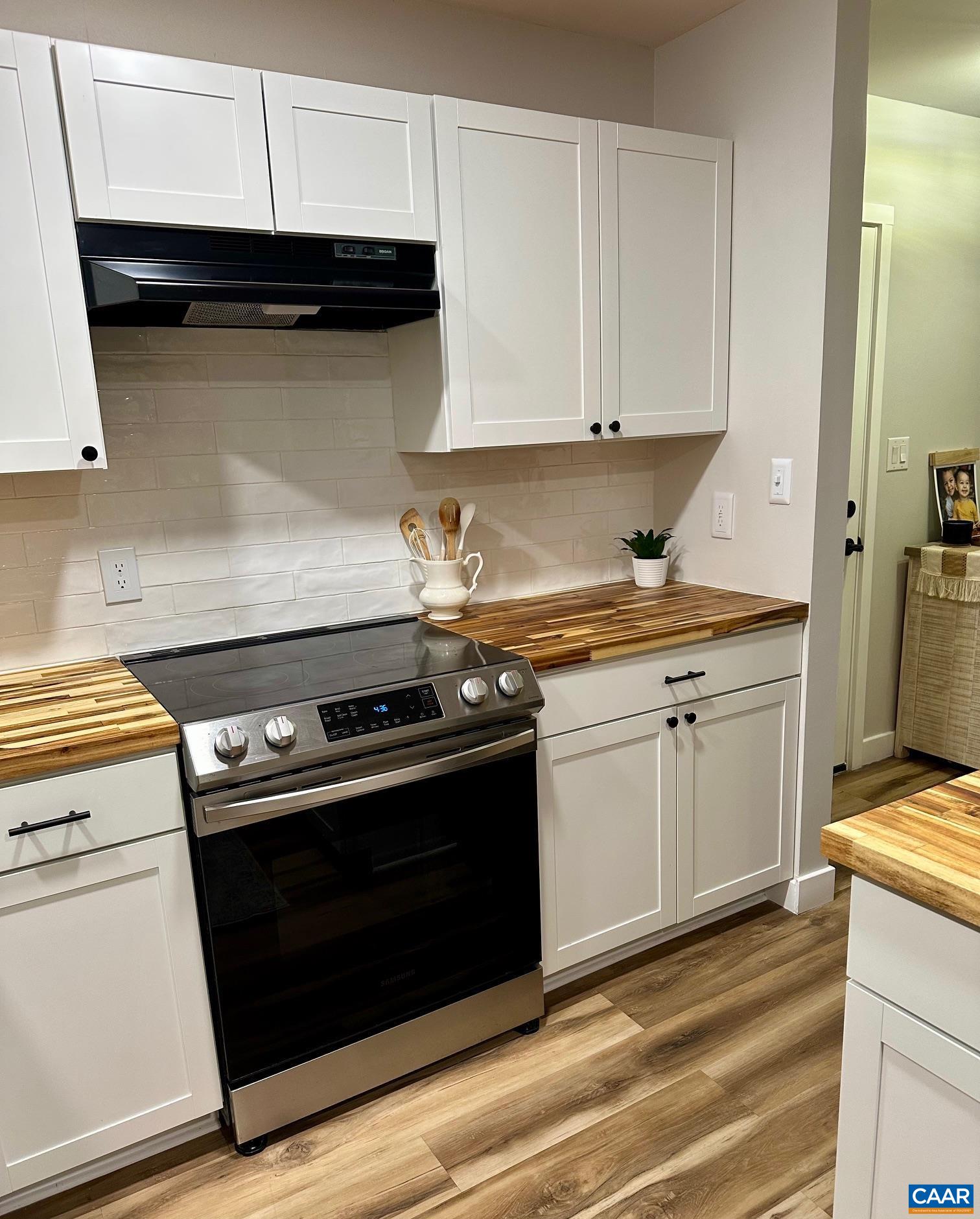 12 Highland Road Palmyra, VA 22963 - Photo 11 of 41 a kitchen with a stove and a microwave