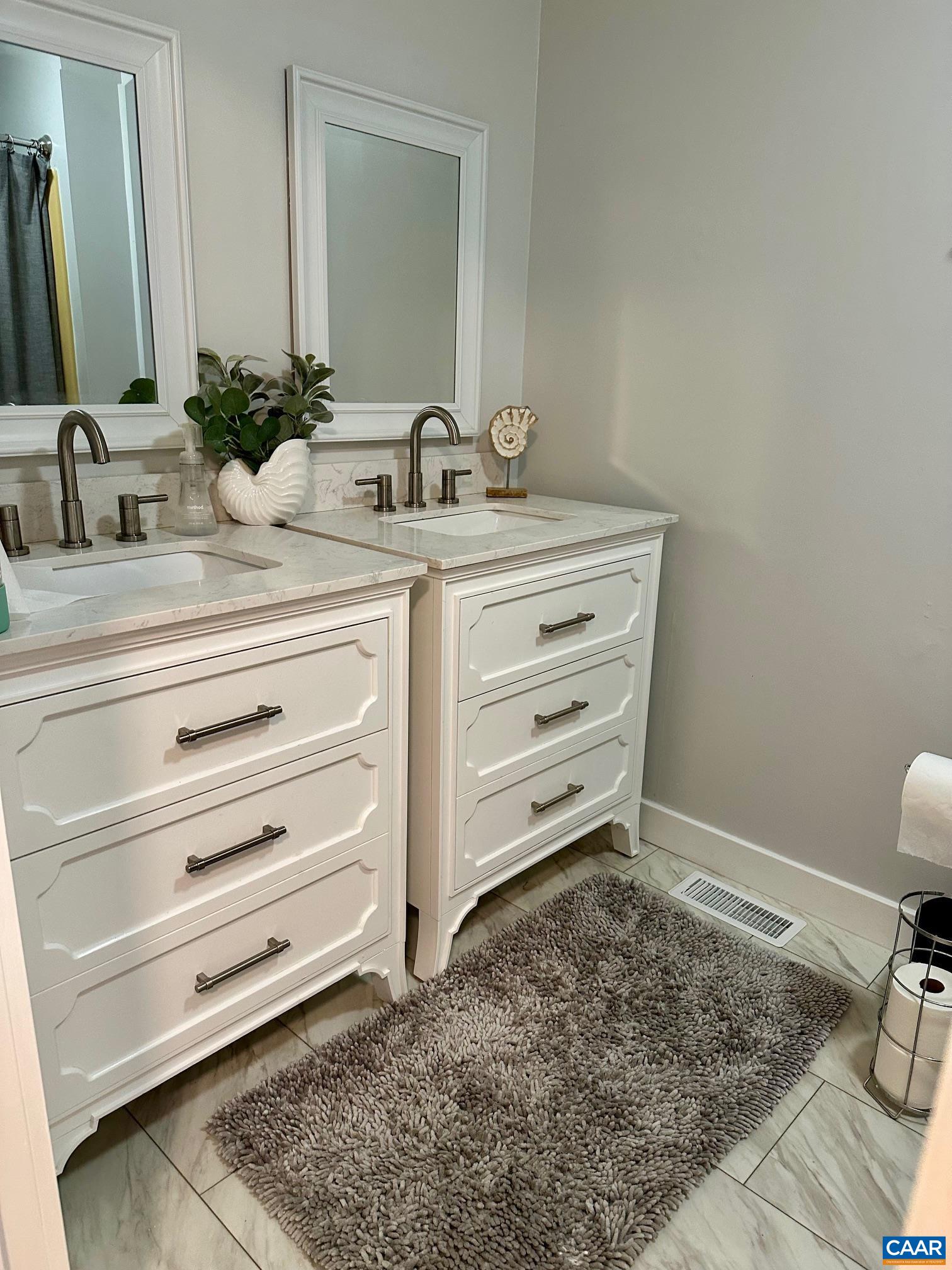 12 Highland Road Palmyra, VA 22963 - Photo 20 of 41 a bathroom with a sink and a mirror