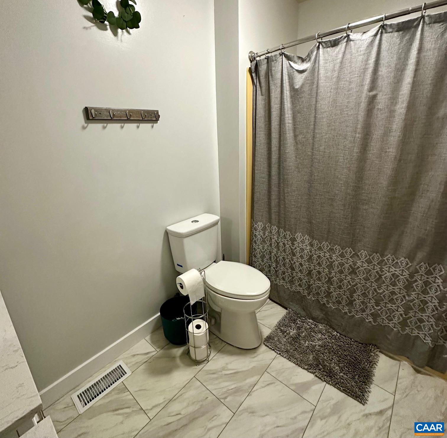 12 Highland Road Palmyra, VA 22963 - Photo 21 of 41 a bathroom with a toilet and a shower