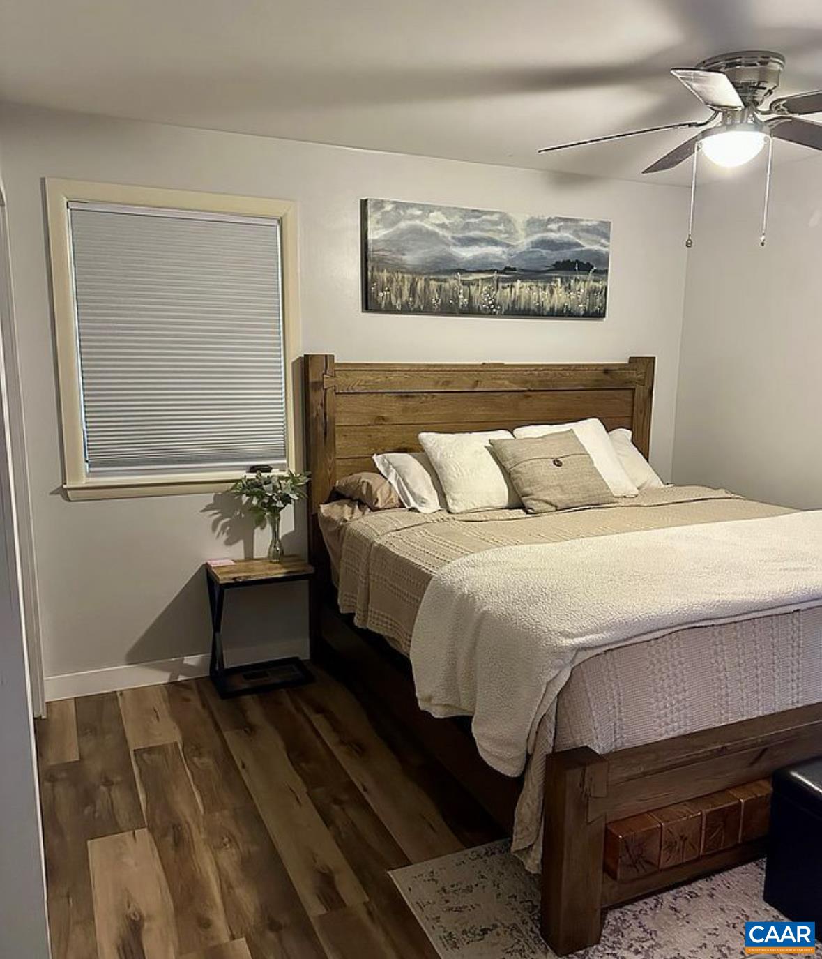 12 Highland Road Palmyra, VA 22963 - Photo 23 of 41 a bedroom with a bed and wooden floor