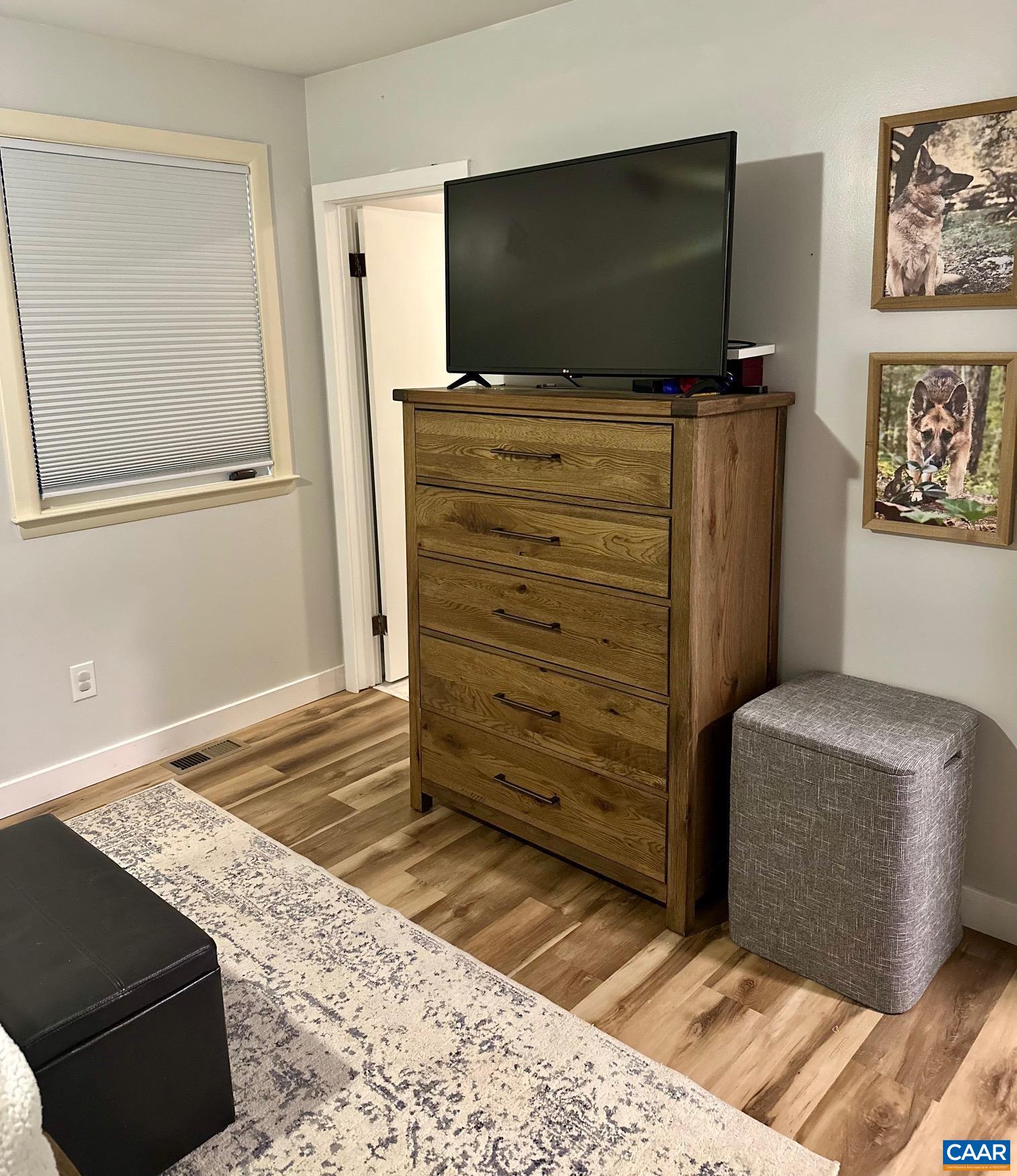 12 Highland Road Palmyra, VA 22963 - Photo 24 of 41 a bedroom with a bed and flat screen tv