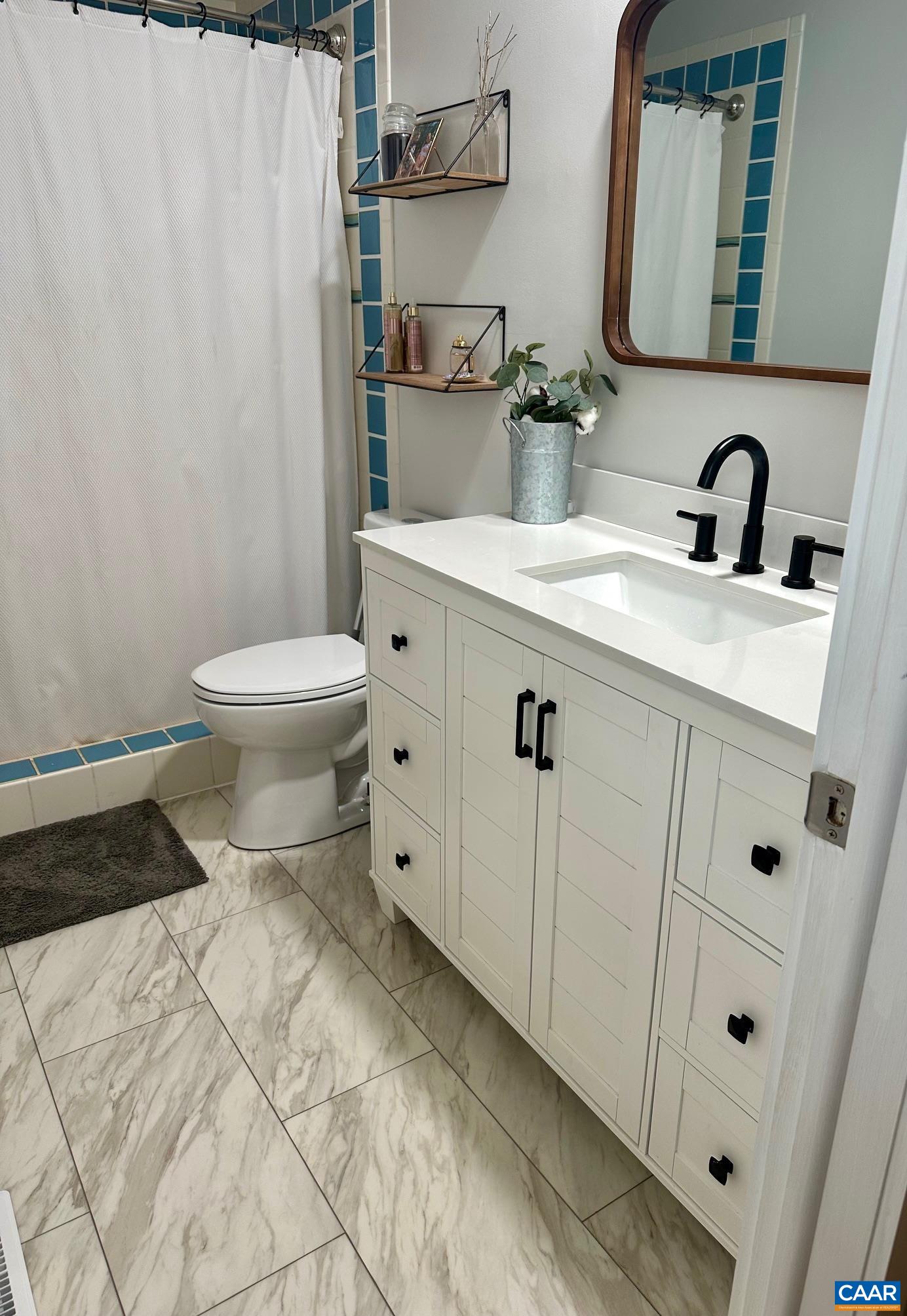 12 Highland Road Palmyra, VA 22963 - Photo 26 of 41 a bathroom with a sink toilet and shower