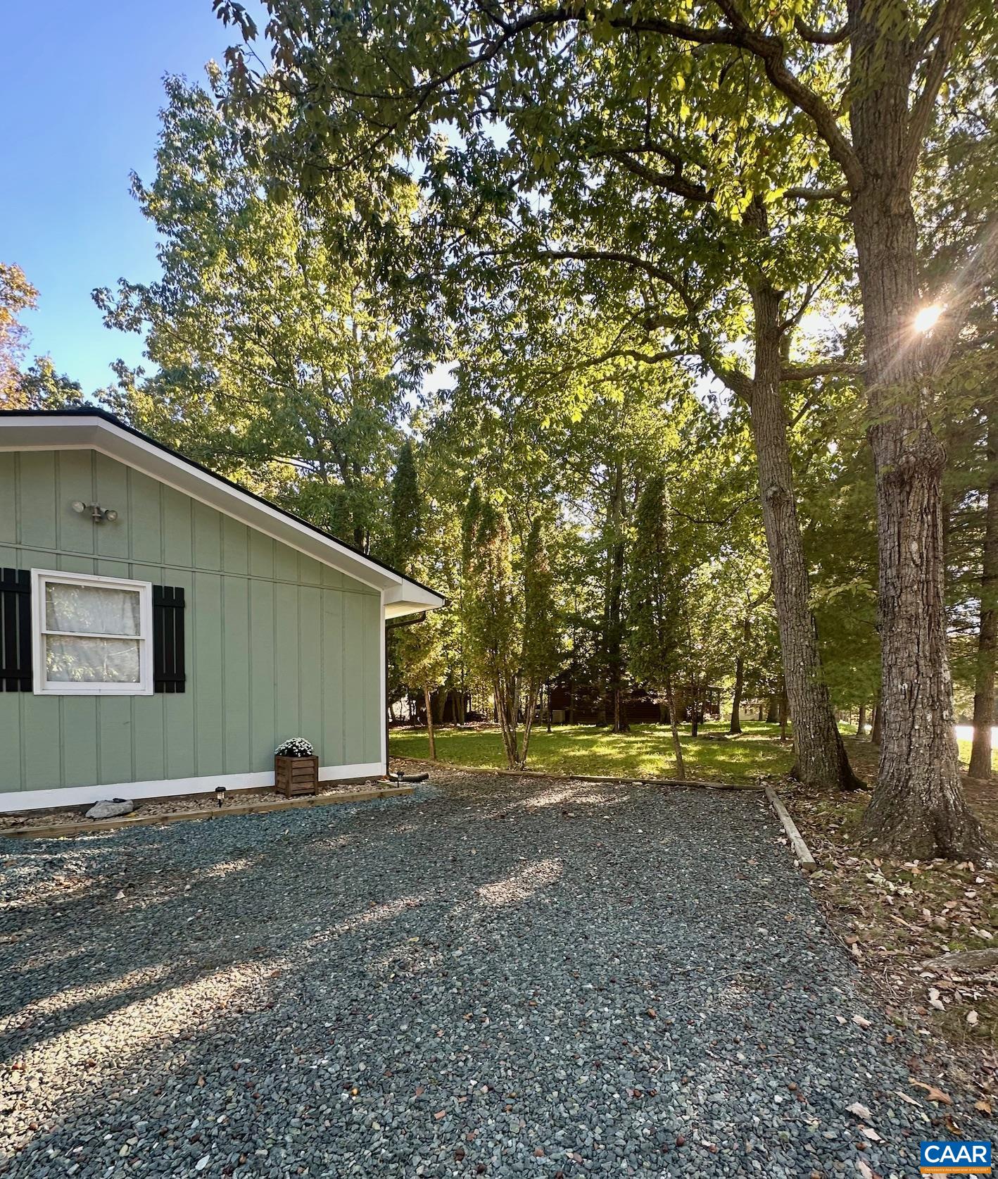 12 Highland Road Palmyra, VA 22963 - Photo 4 of 41 a view of a backyard with large trees