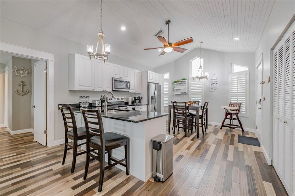4021 Casa Court Hernando Beach, FL 34607 - Photo 13 of 37 a view of a dining room with furniture and wooden floor