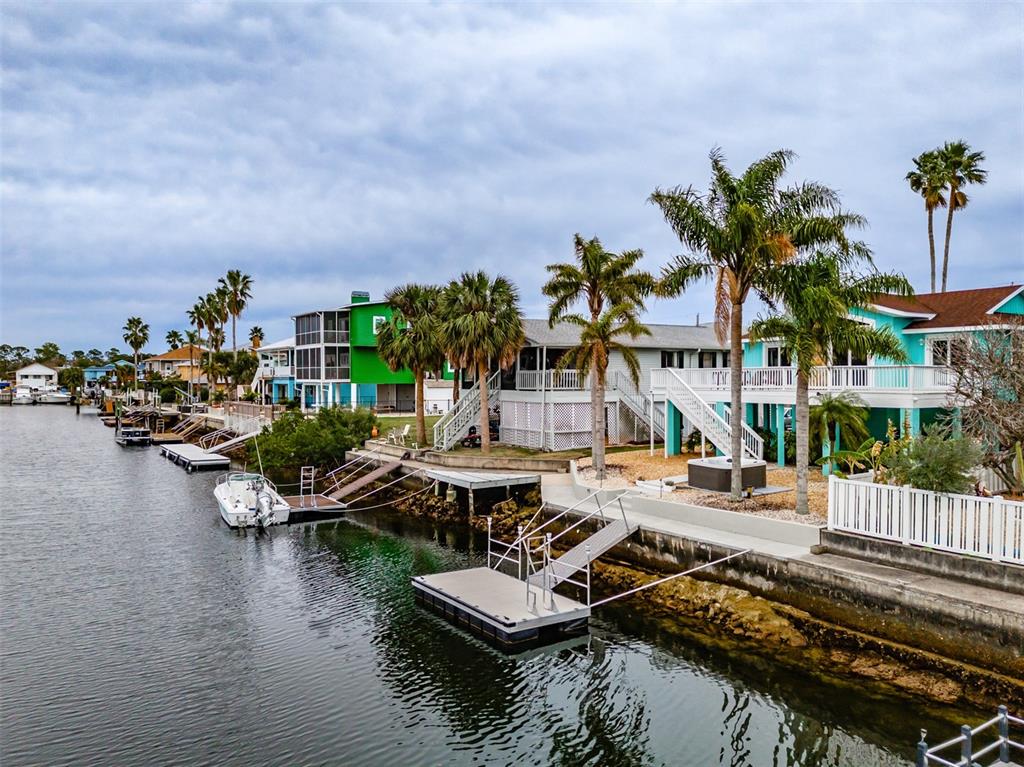 4021 Casa Court Hernando Beach, FL 34607 - Photo 29 of 37 a view of a lake with lawn chairs