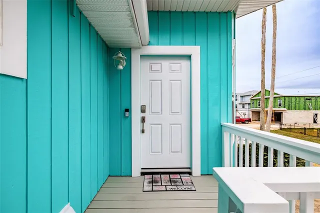 a view of front door with yard