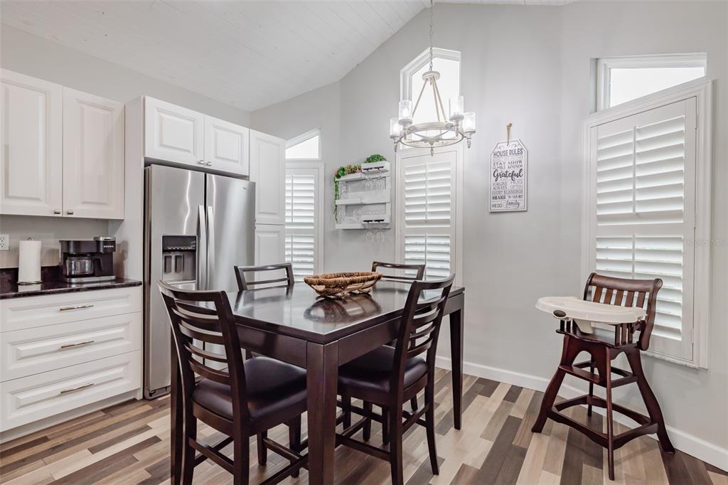 4021 Casa Court Hernando Beach, FL 34607 - Photo 33 of 37 a view of a dining room with furniture and a chandelier