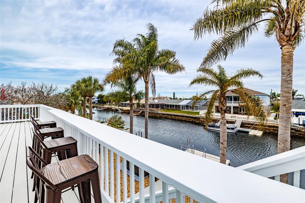 4021 Casa Court Hernando Beach, FL 34607 - Photo 5 of 37 a balcony with wooden floor and city view