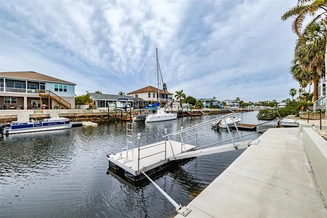 a view of swimming pool with outdoor seating and yard in the back