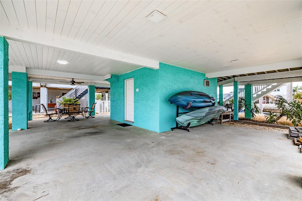 4021 Casa Court Hernando Beach, FL 34607 - Photo 9 of 37 a view of a livingroom with furniture and a garage