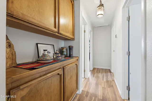 a bedroom with a bed dresser and a window