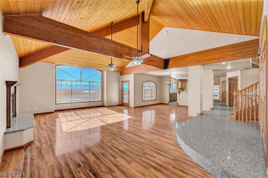 640 North Racetrack Road Henderson, NV 89015 - Photo 18 of 65 Natural light floods this great room, highlighting the high ceilings and elegant wood flooring.