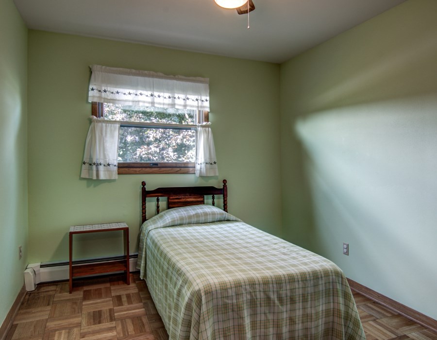 14851 Freeport Road Durand, IL 61024 - Photo 16 of 25 a bedroom with a bed and a window