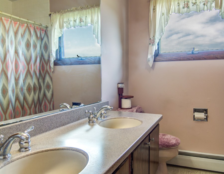 14851 Freeport Road Durand, IL 61024 - Photo 19 of 25 a bathroom with a granite countertop sink and a mirror