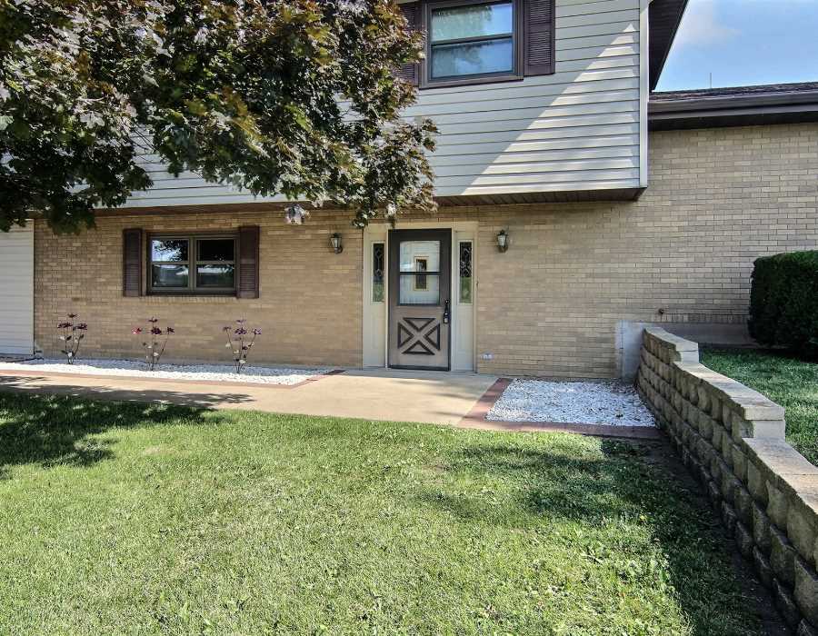 14851 Freeport Road Durand, IL 61024 - Photo 2 of 25 a front view of a house with a yard