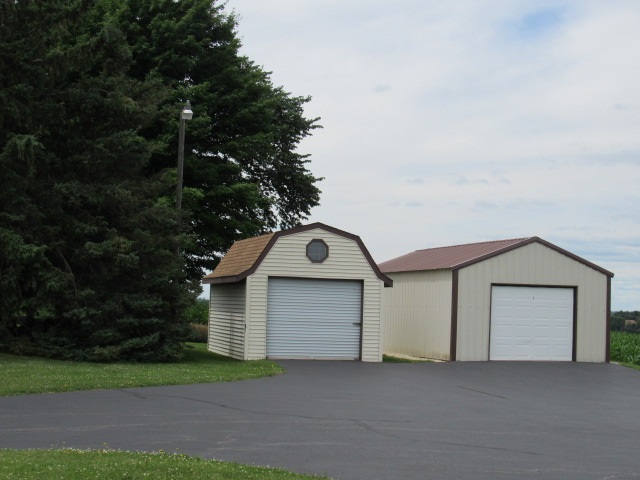 14851 Freeport Road Durand, IL 61024 - Photo 23 of 25 a front view of a house with garage