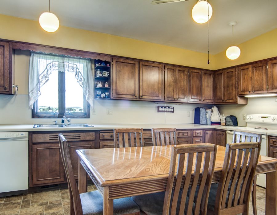 14851 Freeport Road Durand, IL 61024 - Photo 10 of 25 a kitchen with a stove a sink and cabinets
