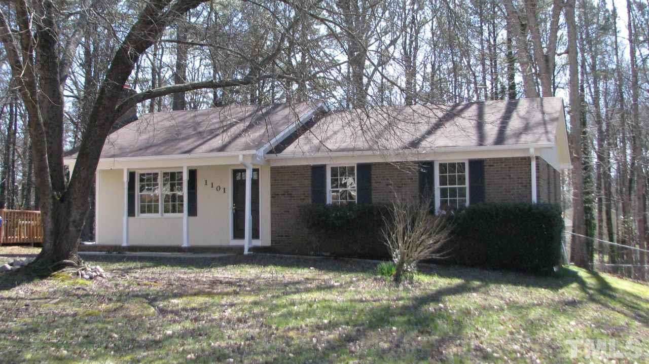 1101 Mockingbird Drive Raleigh, NC 27615 - Photo 1 of 21 front view of a house with a yard