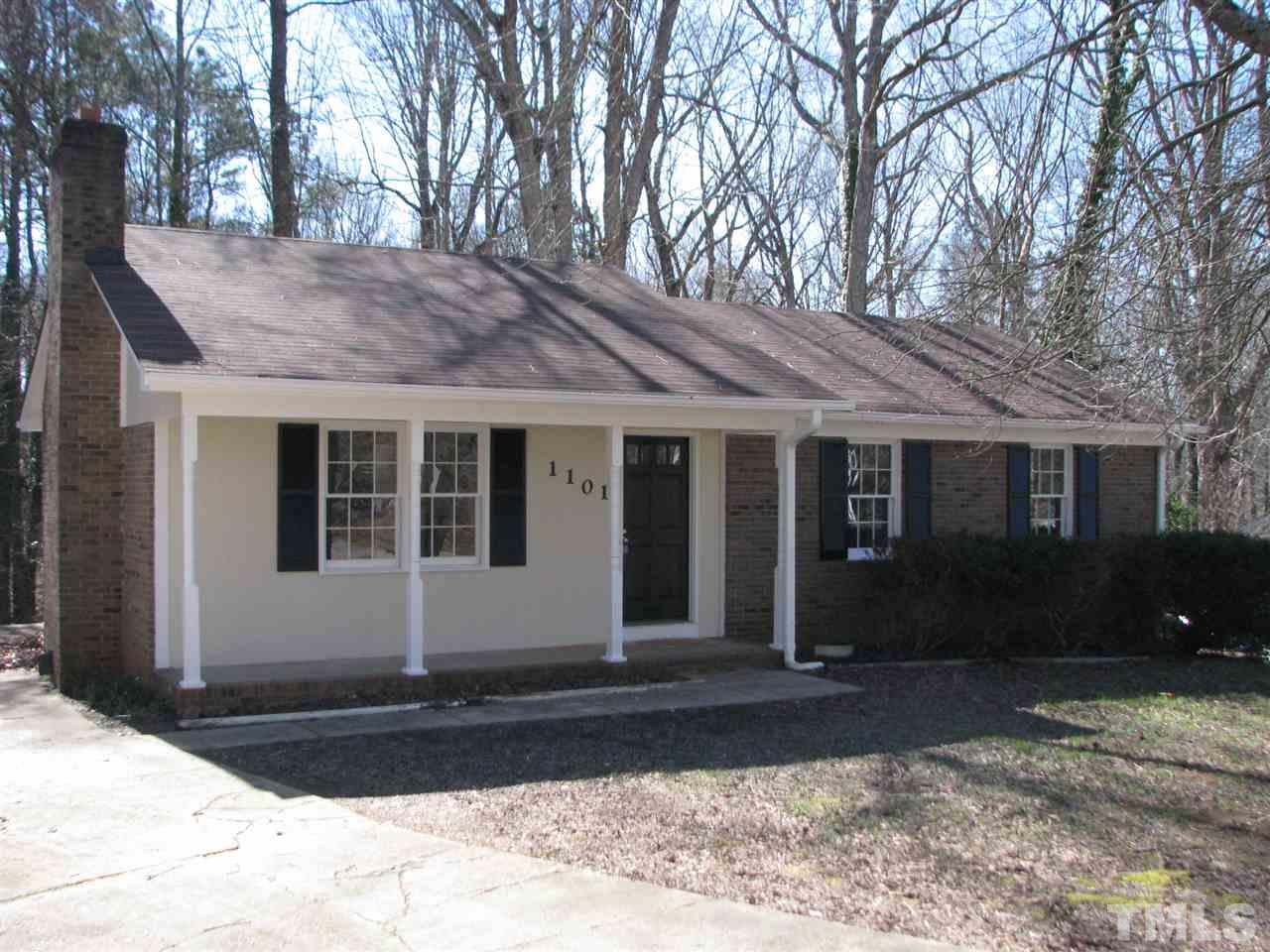 1101 Mockingbird Drive Raleigh, NC 27615 - Photo 2 of 21 a front view of a house with a yard