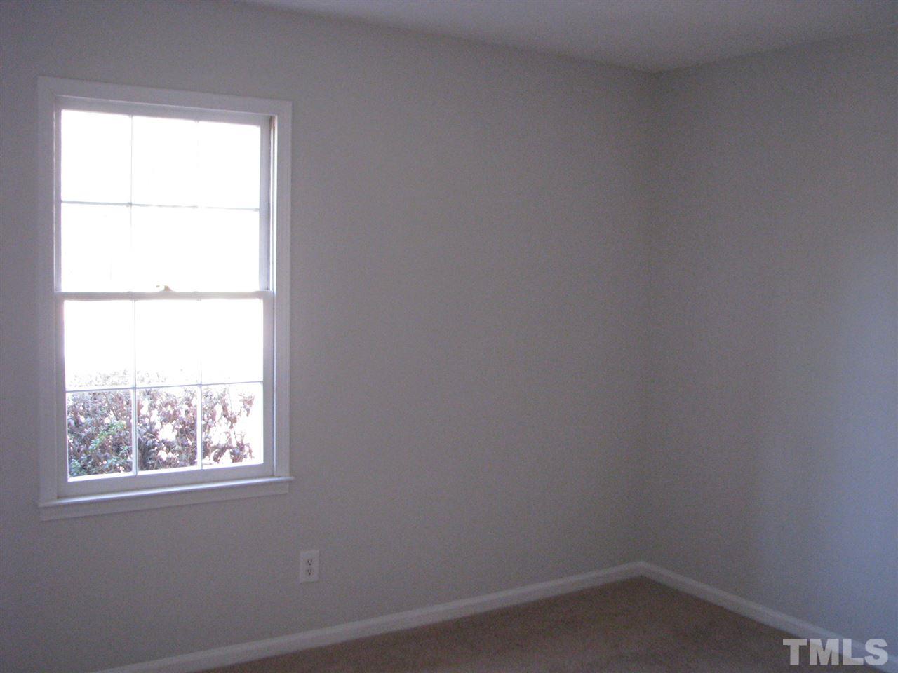 1101 Mockingbird Drive Raleigh, NC 27615 - Photo 12 of 21 an empty room with a window