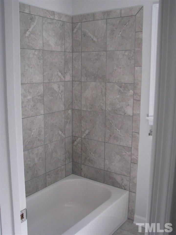 1101 Mockingbird Drive Raleigh, NC 27615 - Photo 17 of 21 a bathroom with a bathtub