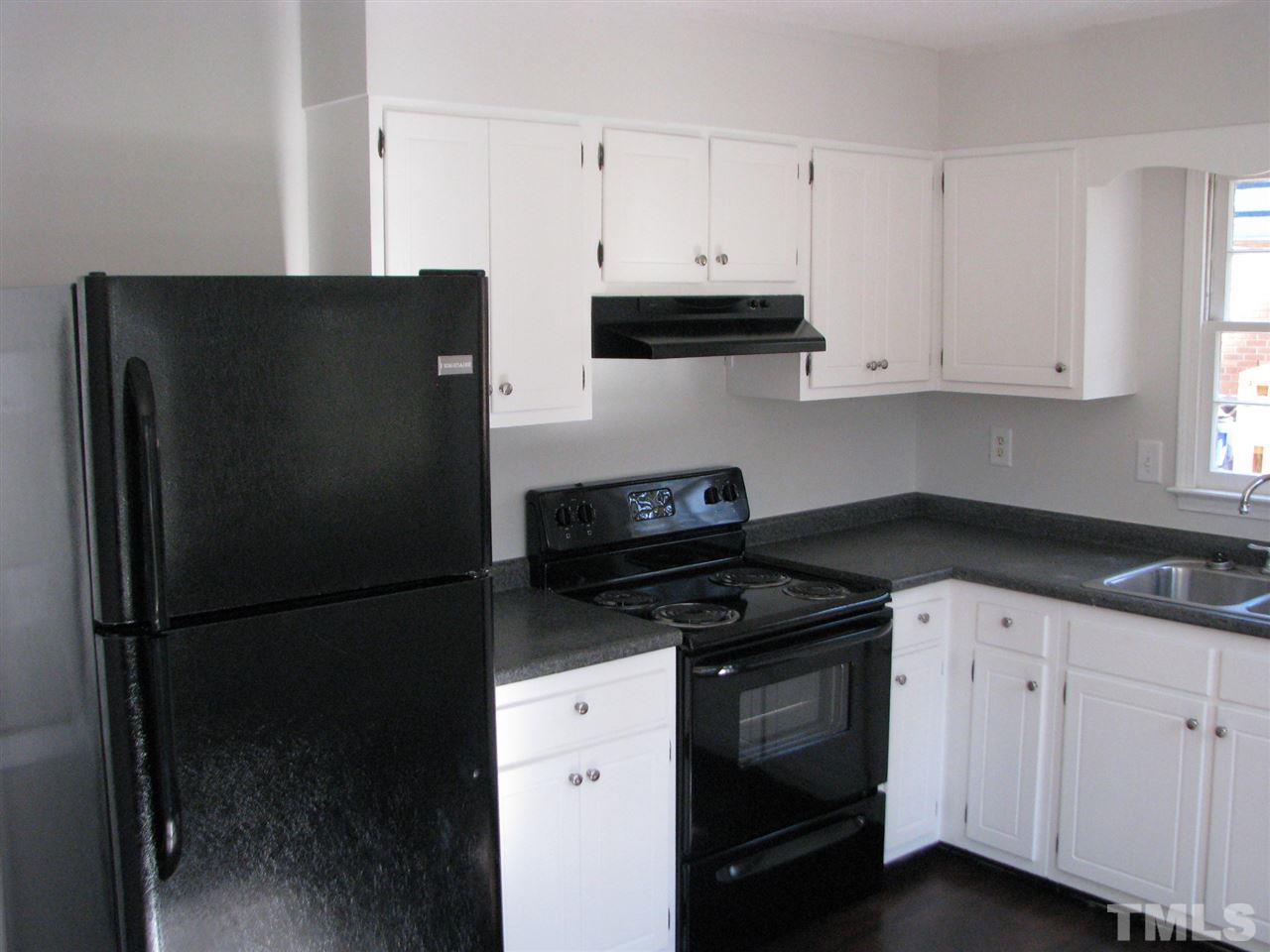1101 Mockingbird Drive Raleigh, NC 27615 - Photo 4 of 21 a kitchen with cabinets and appliances