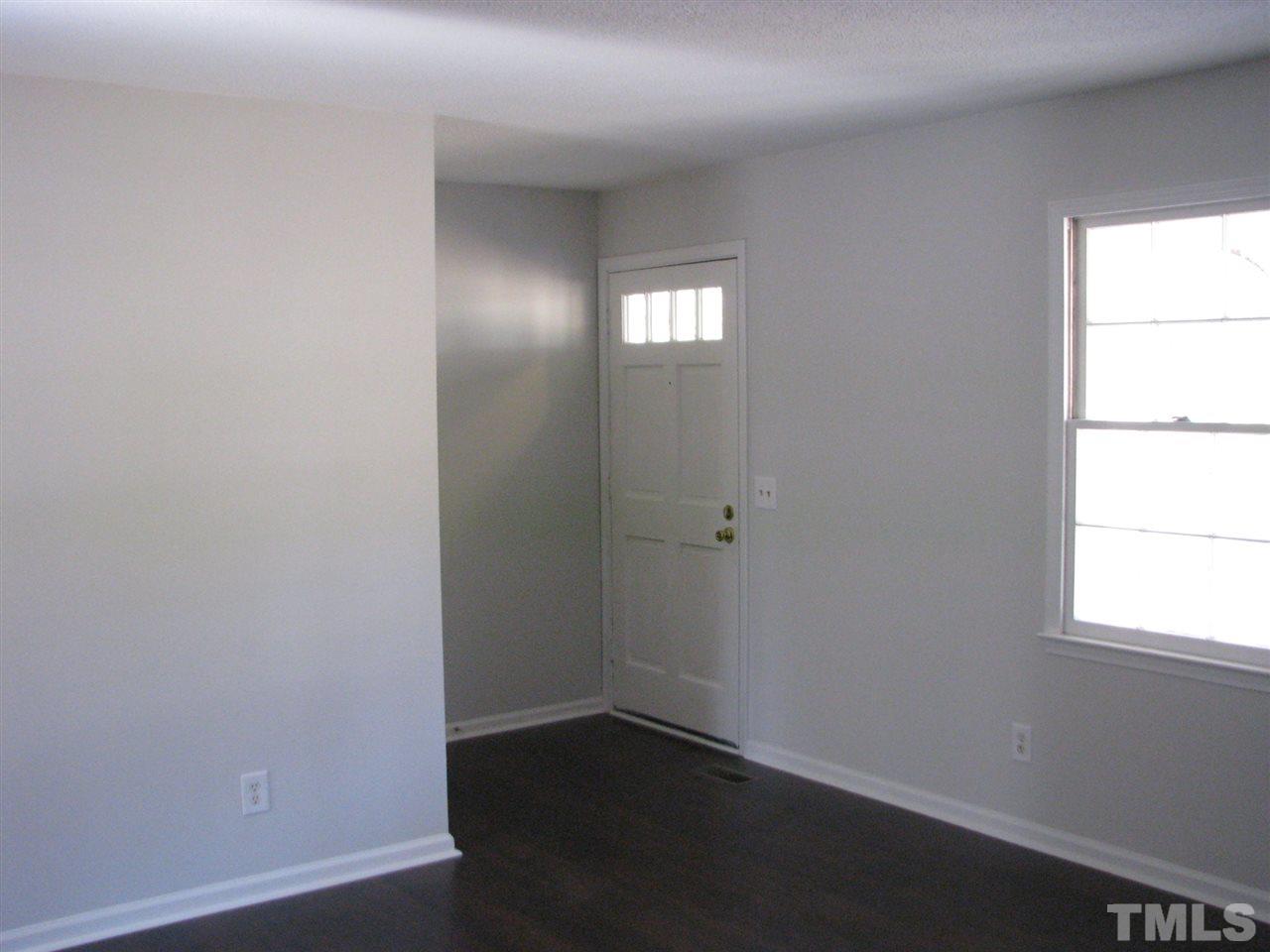 1101 Mockingbird Drive Raleigh, NC 27615 - Photo 6 of 21 an empty room with windows