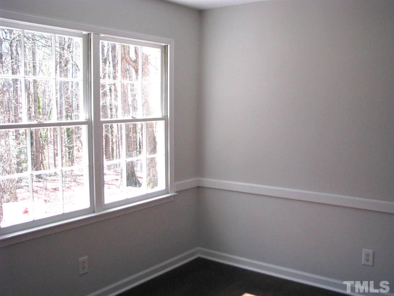 1101 Mockingbird Drive Raleigh, NC 27615 - Photo 7 of 21 an empty room with a window