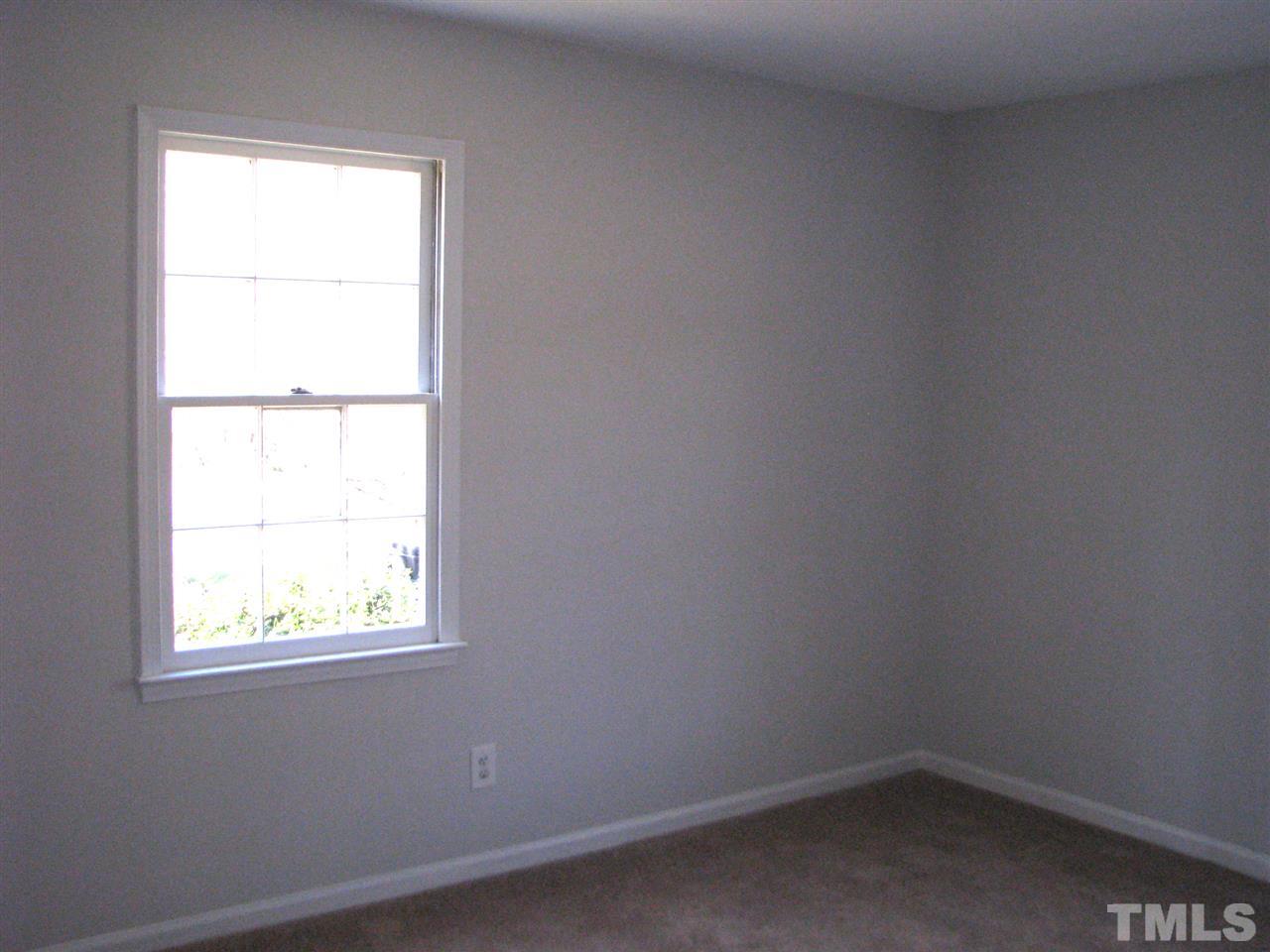 1101 Mockingbird Drive Raleigh, NC 27615 - Photo 10 of 21 an empty room with a window