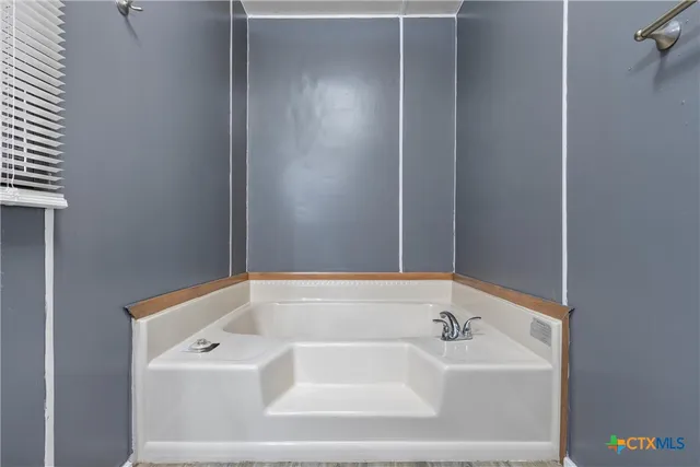 a bathroom with a bathtub