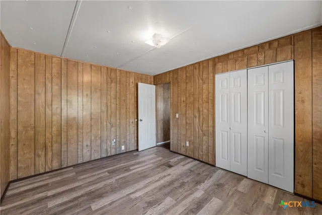 a view of a room with wooden walls