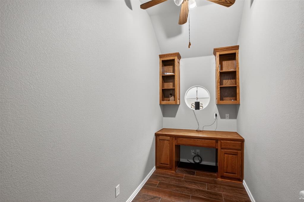 8208 Riversprings Drive Fort Worth, TX 76053 - Photo 18 of 26 a bedroom with a bed and a chandelier