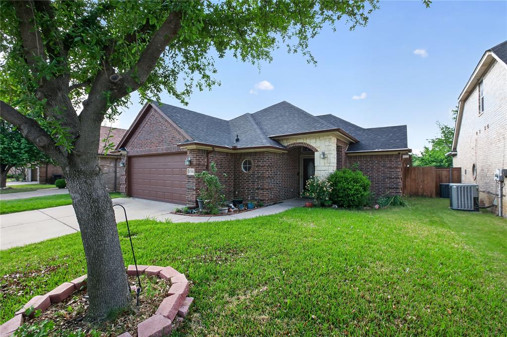 8208 Riversprings Drive Fort Worth, TX 76053 - Photo 2 of 26 a view of a house with a yard potted plants and a large tree