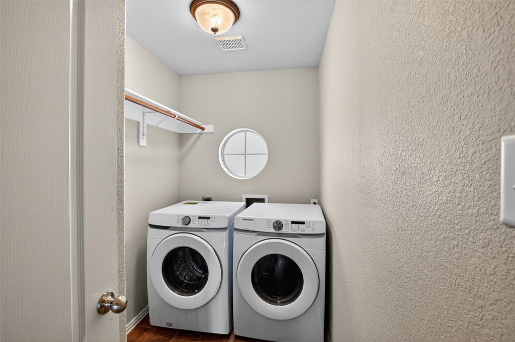 8208 Riversprings Drive Fort Worth, TX 76053 - Photo 22 of 26 a utility room with dryer and washer