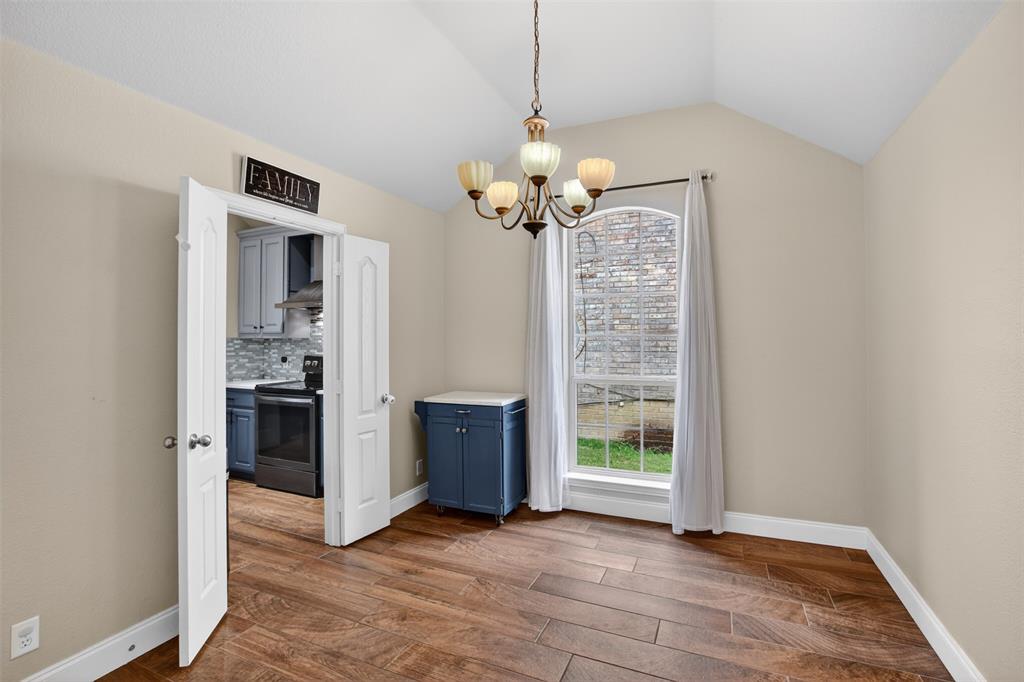8208 Riversprings Drive Fort Worth, TX 76053 - Photo 7 of 26 a view of a big room with windows and chandelier