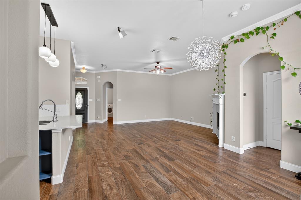 8208 Riversprings Drive Fort Worth, TX 76053 - Photo 8 of 26 a view of a hallway with wooden floor and staircase