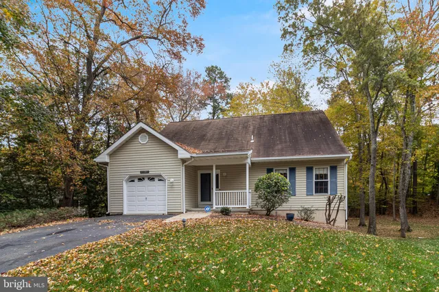 a view of a house with a tree