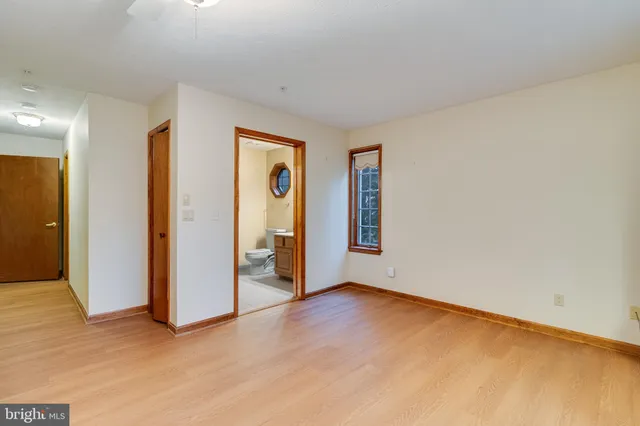 a view of room with window and ceiling fan