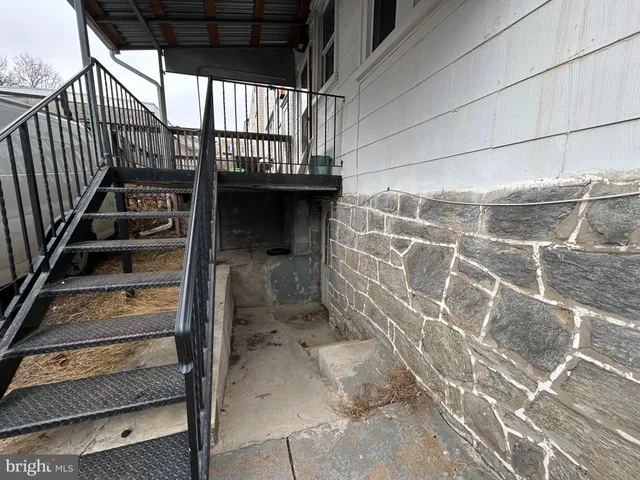a view of balcony with wooden floor