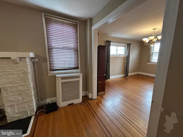 a view of a room with wooden floor and stairs