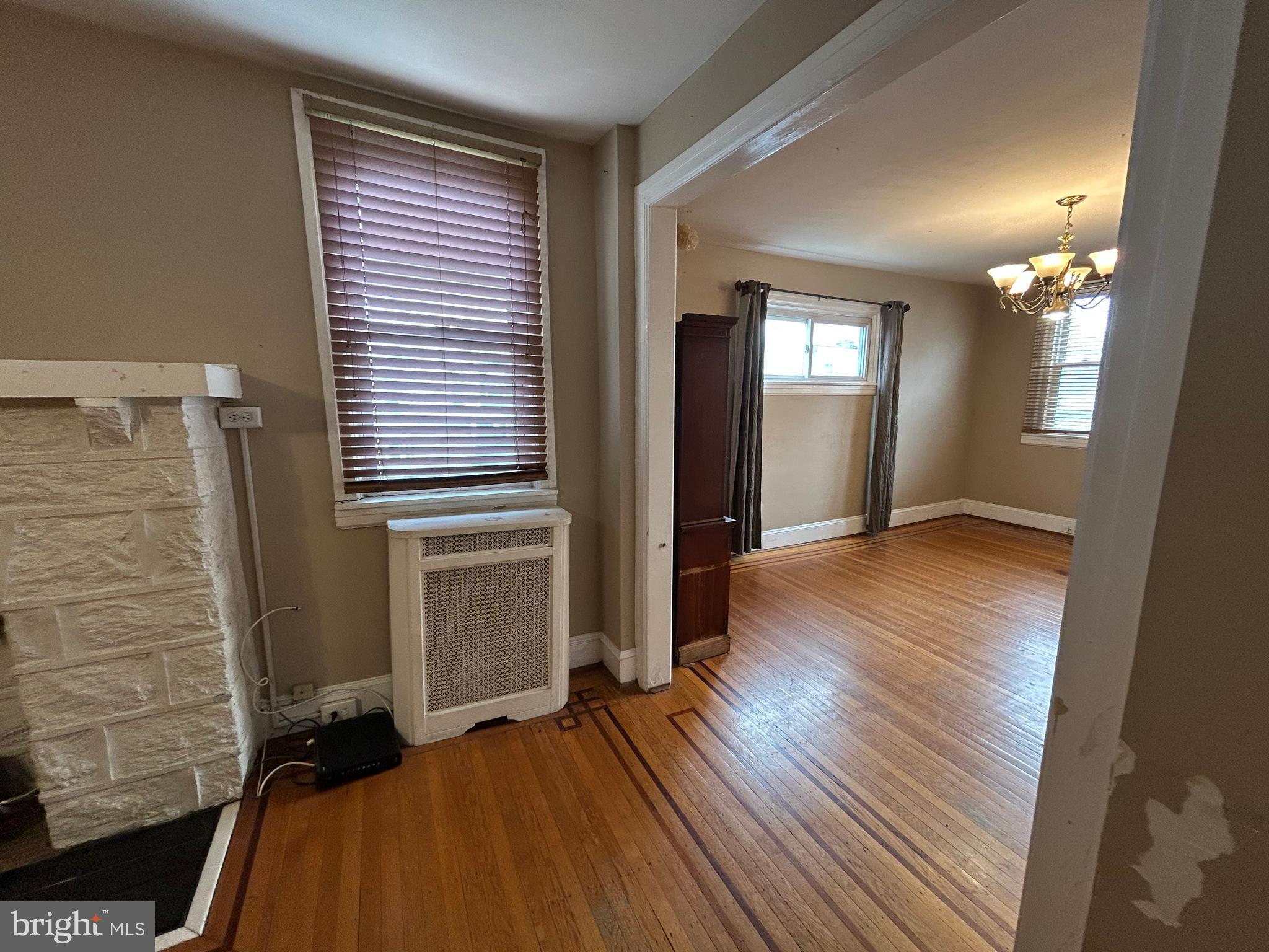 7502 Parkview Road Upper Darby, PA 19082 - Photo 9 of 63 a view of a room with wooden floor and stairs