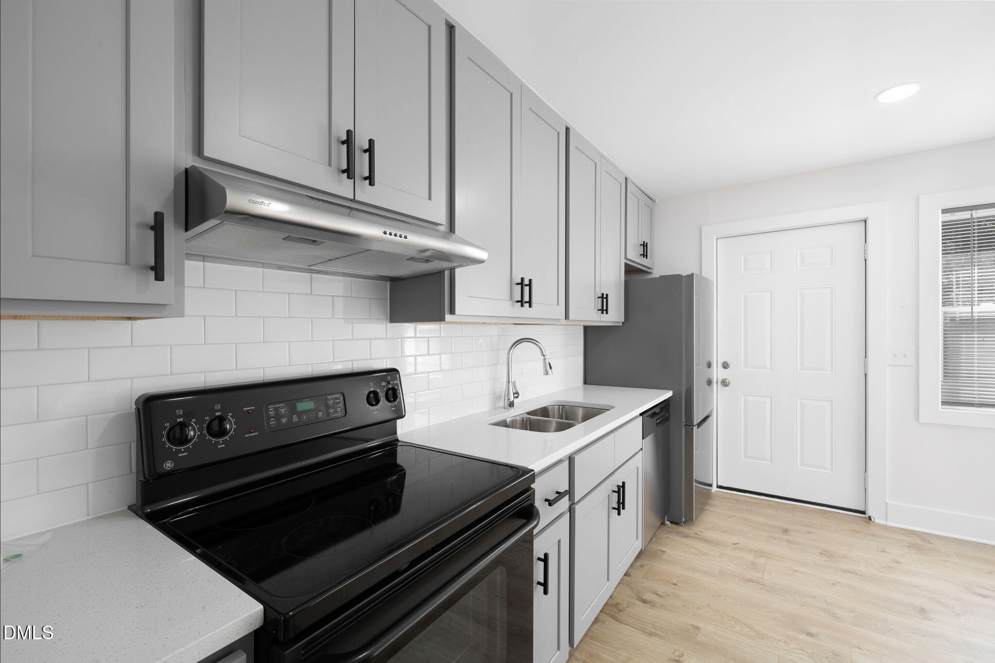 512 East Branch Street Spring Hope, NC 27882 - Photo 11 of 30 a kitchen with a stove and a refrigerator